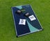 DW Original Bag Toss Game - Board laid on grass with 2 black bean bags and 2 white bean bags