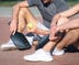 DW Original Tornado Pickleball Paddle - Two players relaxing after playing Pickleball with the Tornado Pickleball Paddle